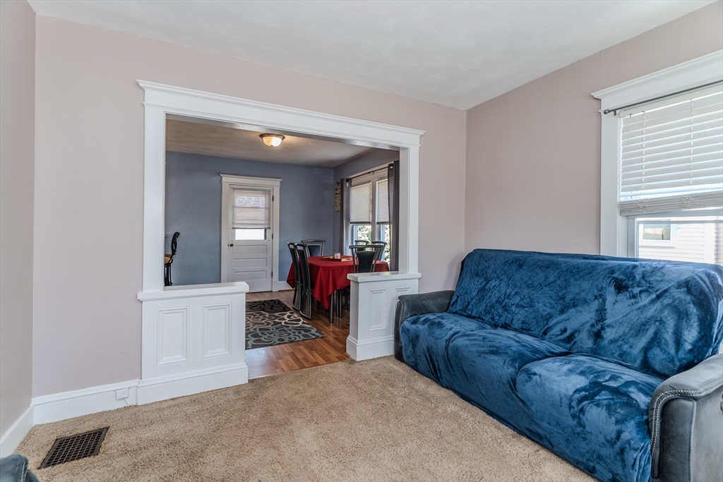 50 Duryea Street Springfield, MA 01104 - Photo 6 of 29 a living room with furniture and a window