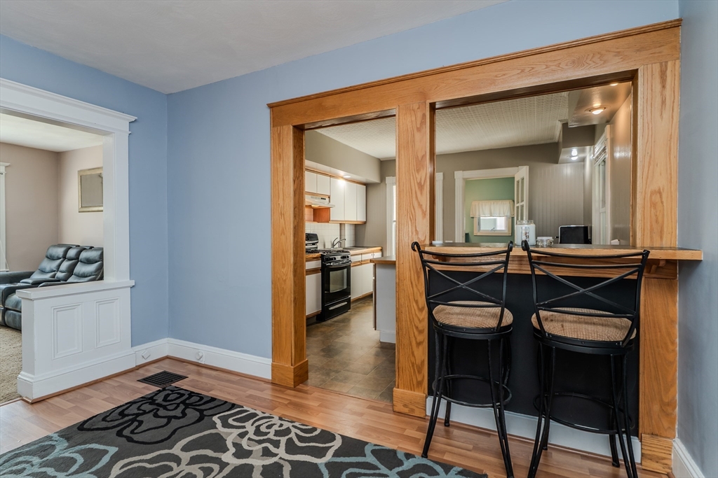 50 Duryea Street Springfield, MA 01104 - Photo 8 of 29 a view of a dining room with furniture and wooden floor