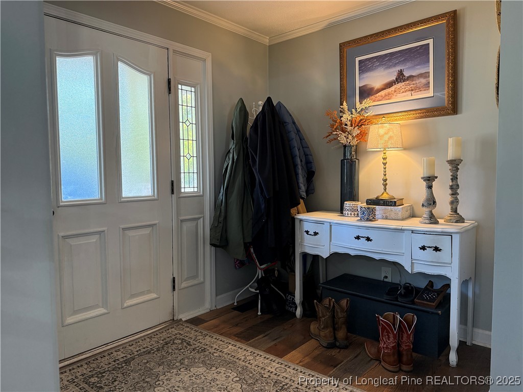 3057 Westminster Road Lumberton, NC 28360 - Photo 11 of 35 a room with a baby crib and a mirror