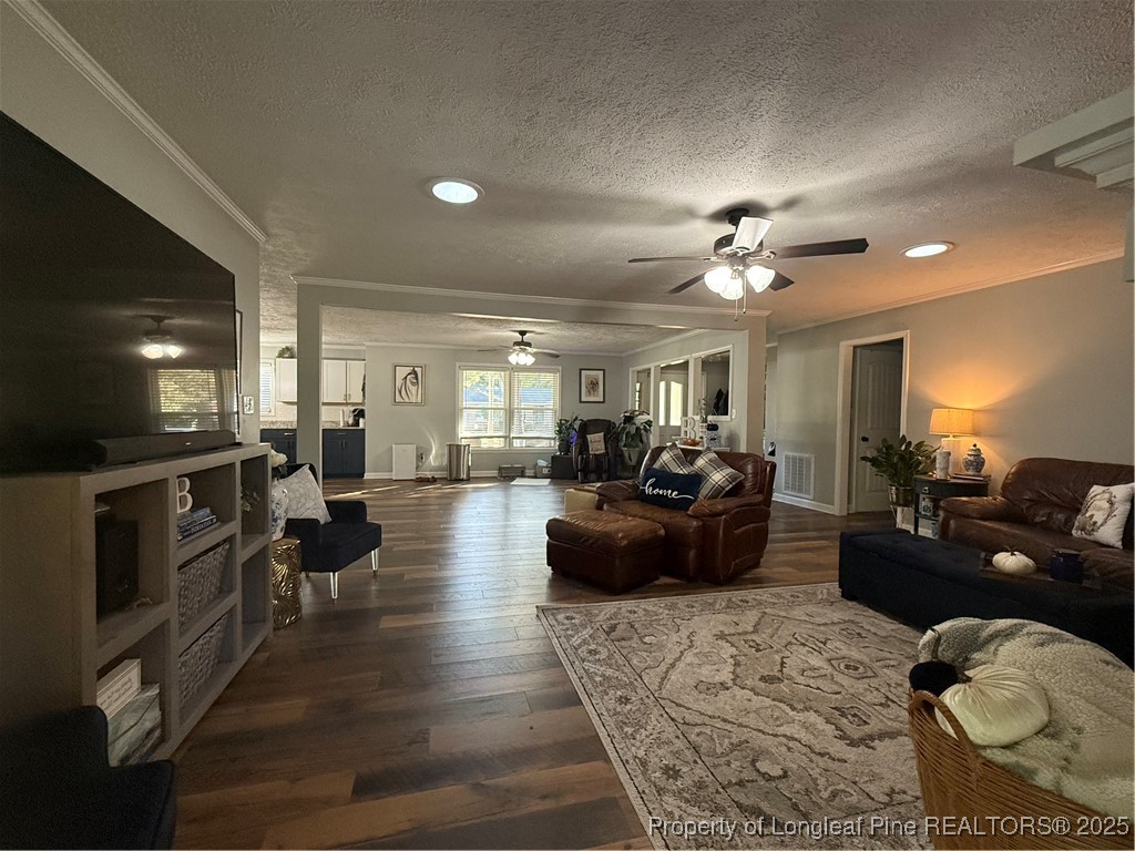 3057 Westminster Road Lumberton, NC 28360 - Photo 17 of 35 a living room with furniture kitchen view and a wooden floor