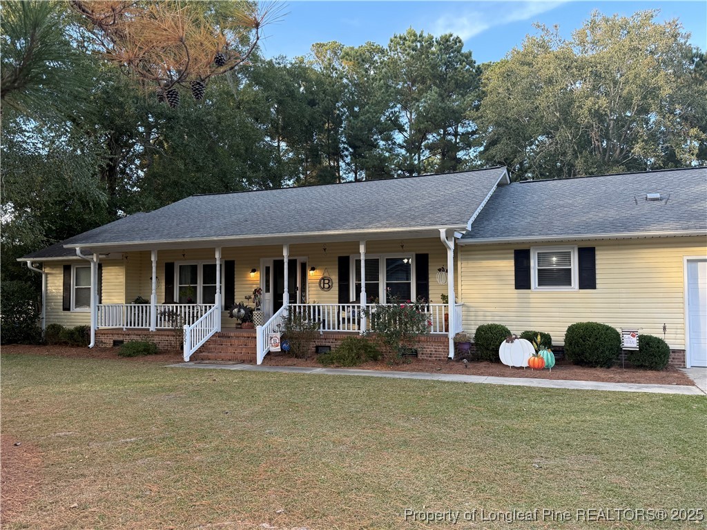 3057 Westminster Road Lumberton, NC 28360 - Photo 2 of 35 a front view of a house with garden
