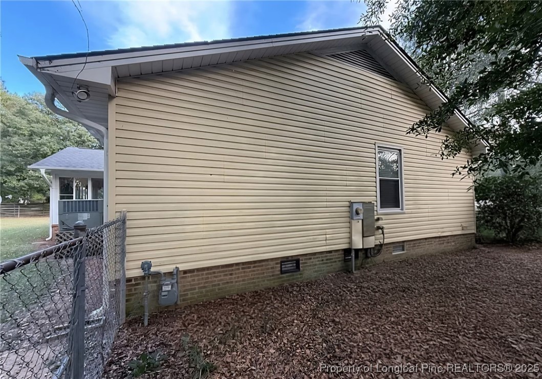 3057 Westminster Road Lumberton, NC 28360 - Photo 9 of 35 a view of a small house with a backyard
