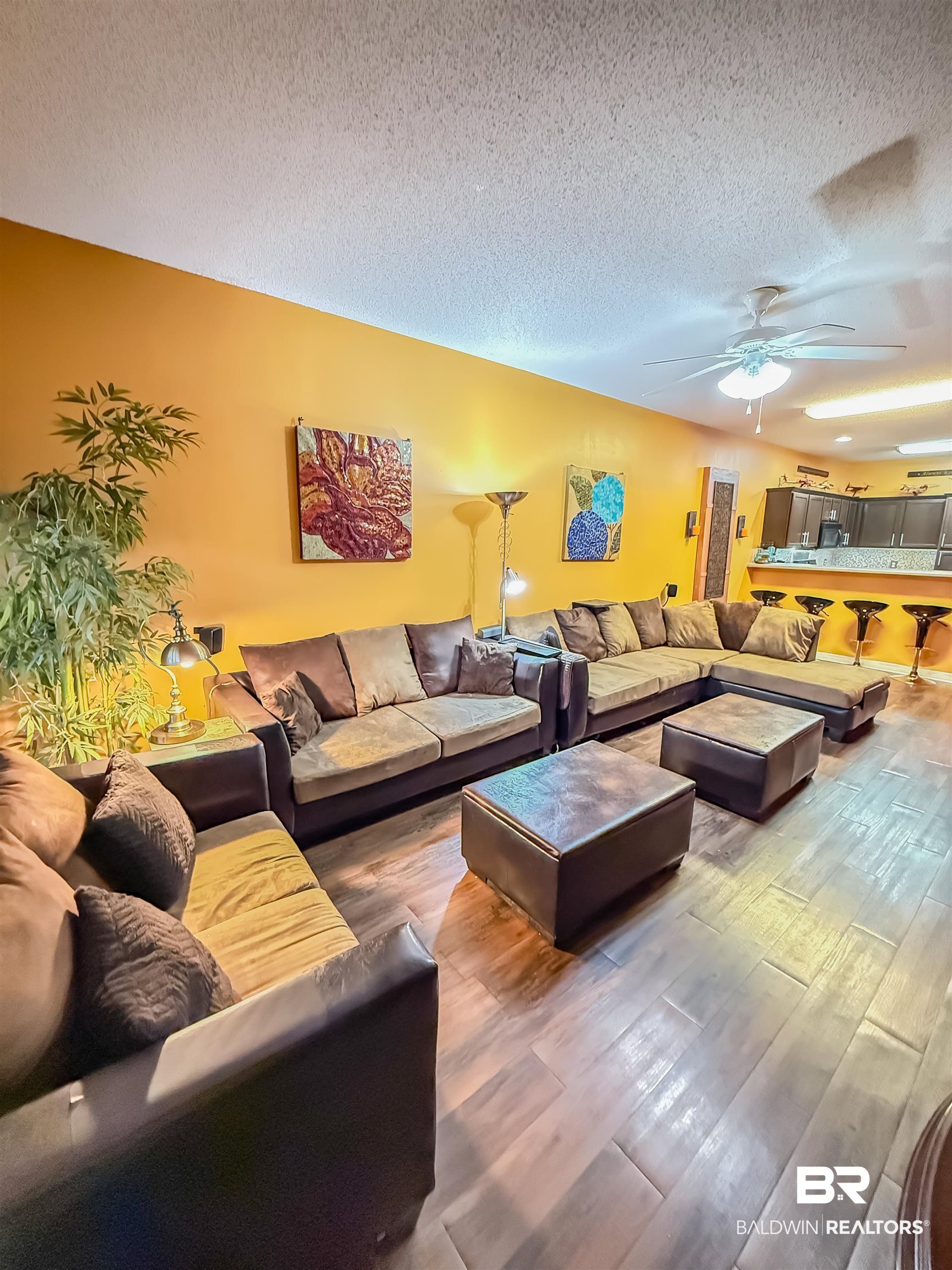 2651 South Juniper Street Foley, AL 36535 - Photo 5 of 20 Living room with a textured ceiling, wood finished floors, and a ceiling fan