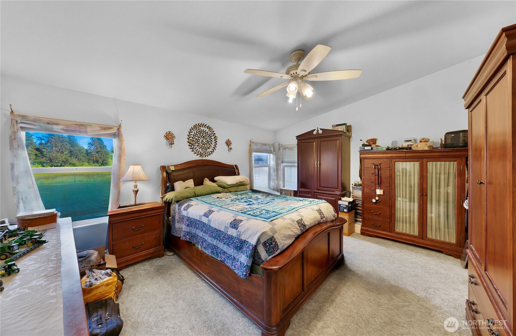 7928 Portal Way Custer, WA 98240 - Photo 25 of 39 a bedroom with a bed and a chandelier