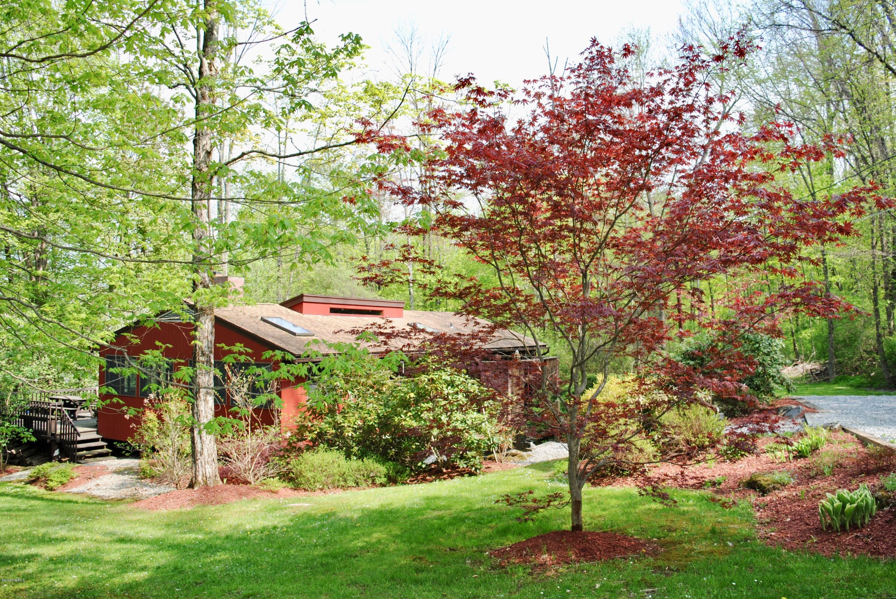 1 Mohigan Road Stockbridge, MA 01262 - Photo 1 of 15 a backyard of a house with lots of green space