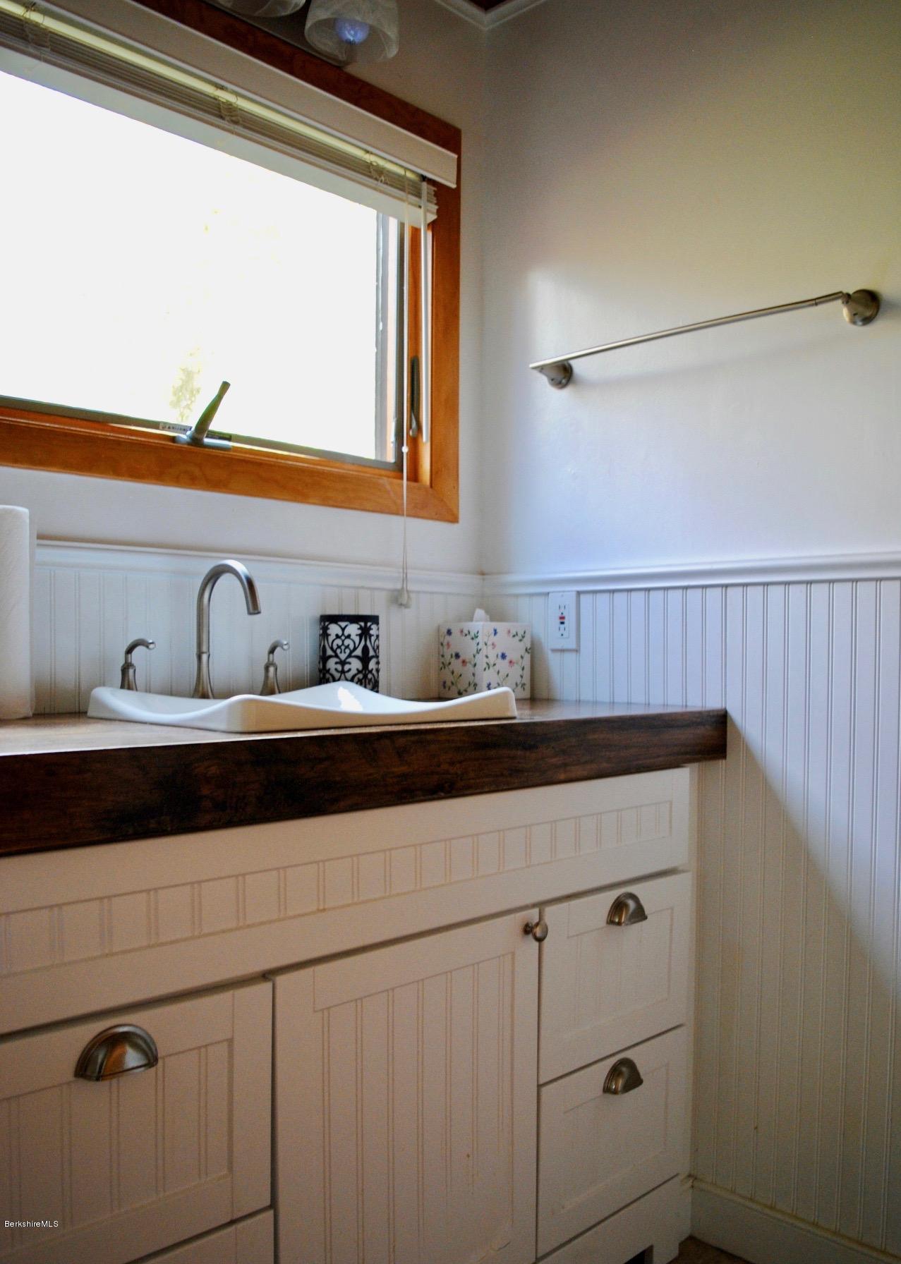 1 Mohigan Road Stockbridge, MA 01262 - Photo 12 of 15 a bathroom with a sink and two mirror