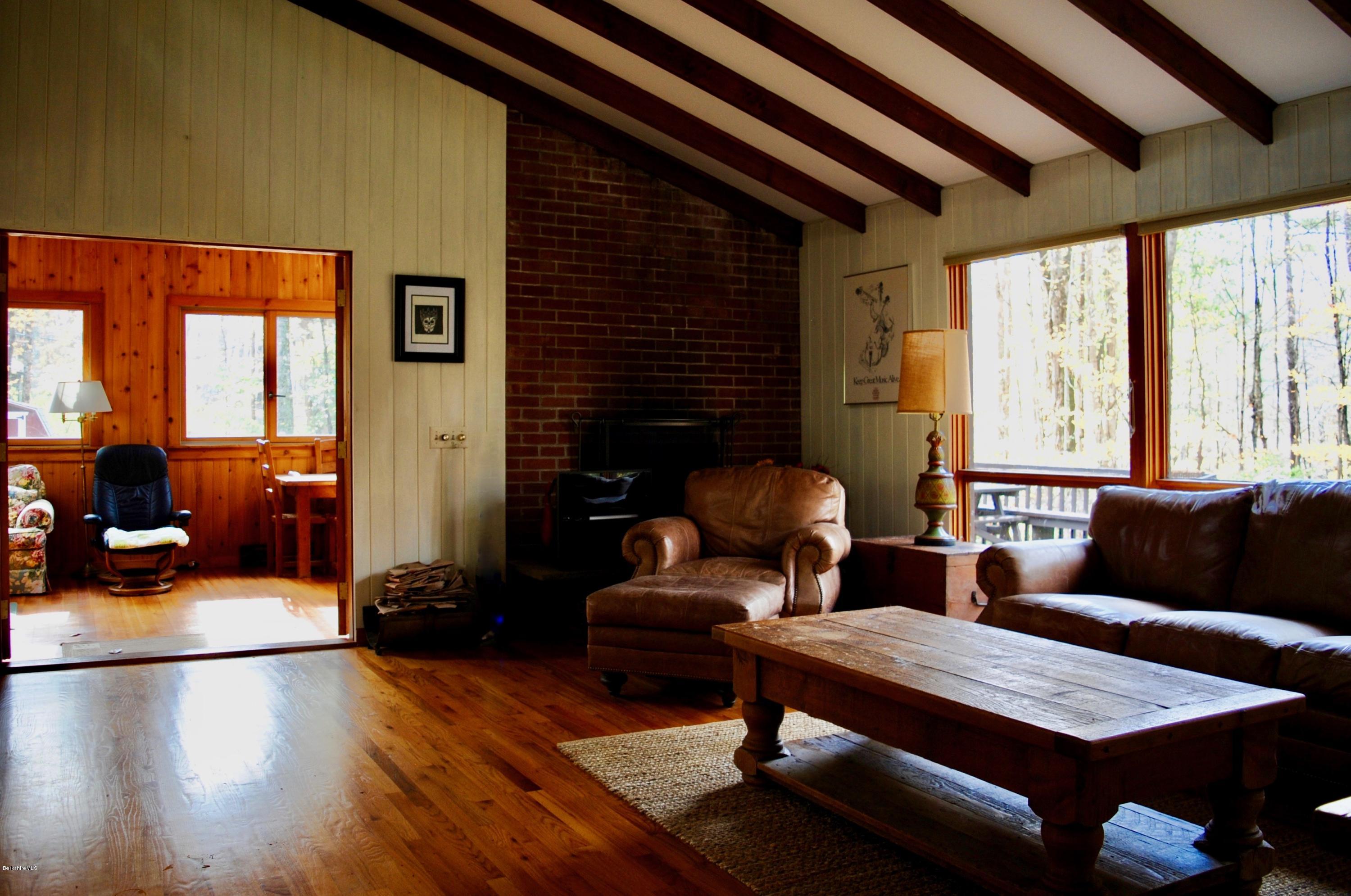 1 Mohigan Road Stockbridge, MA 01262 - Photo 7 of 15 a living room with furniture and a large window