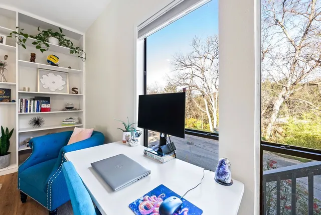 a workspace with furniture and window