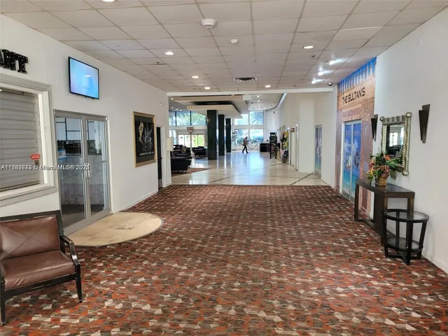 a lobby with furniture and a table