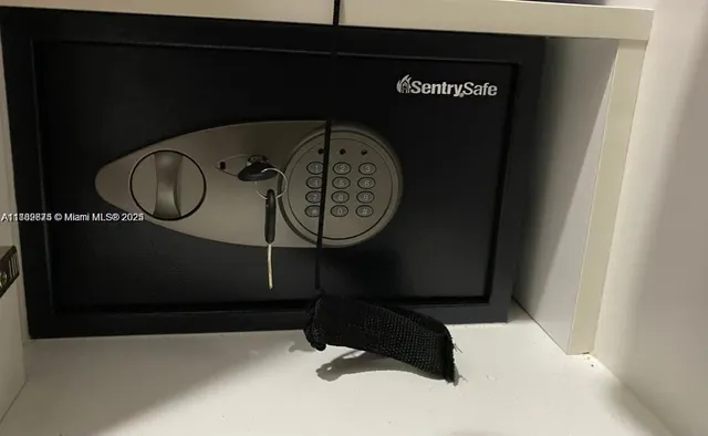 a front view of multi story residential apartment building with yard and parking space