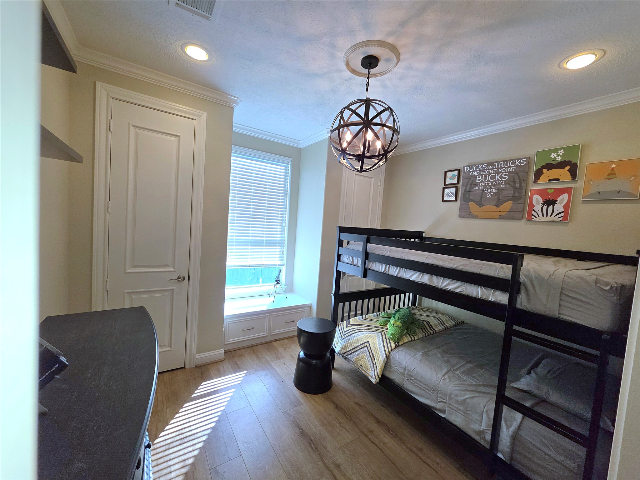 201 Coco Loop Point Blank, TX 77364 - Photo 39 of 50 a hallway with a dining table a chandelier and a wooden floor