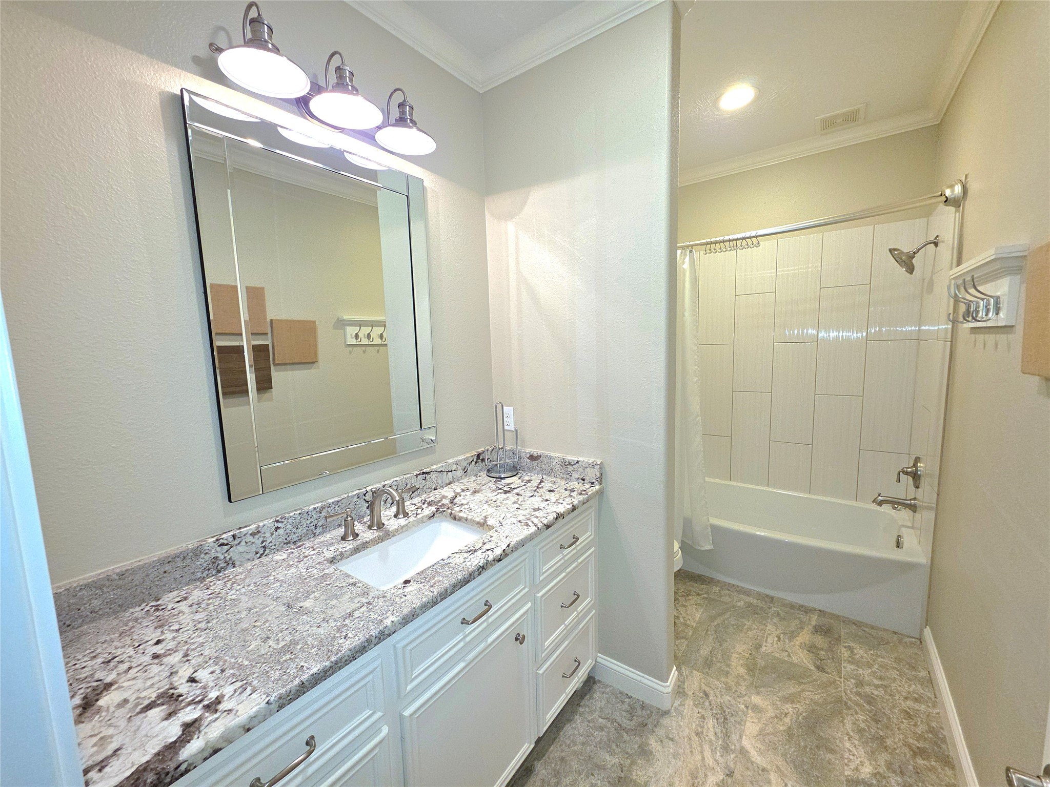 201 Coco Loop Point Blank, TX 77364 - Photo 40 of 50 a bathroom with a granite countertop sink a mirror and a shower