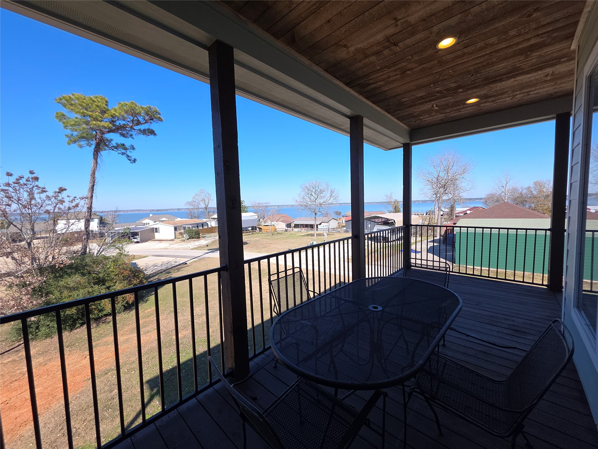 201 Coco Loop Point Blank, TX 77364 - Photo 7 of 50 This photo features a large relaxingwooden deck with big views of Lake Livingston.
