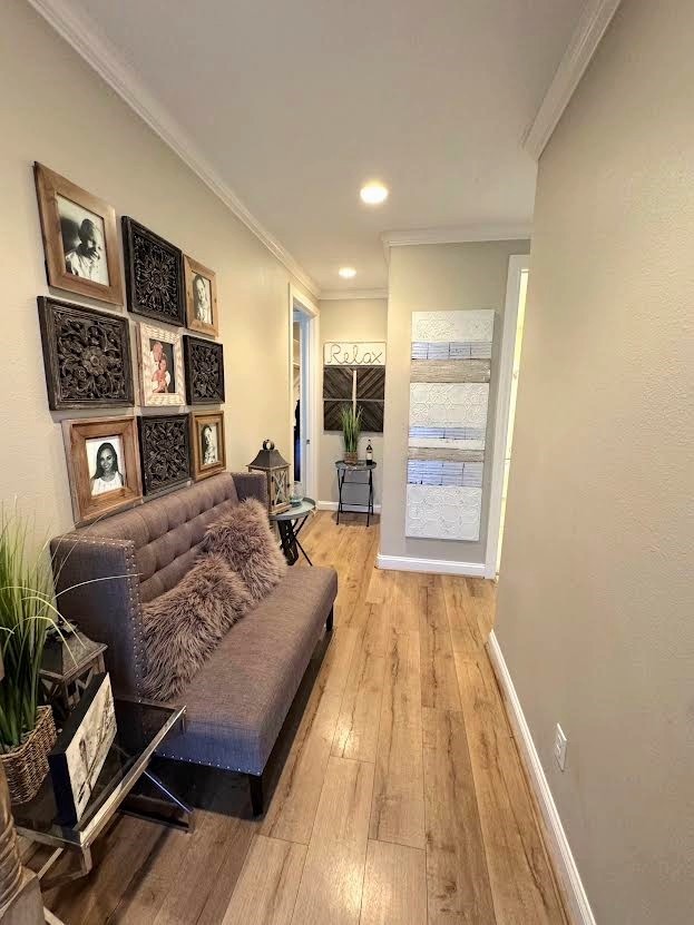 201 Coco Loop Point Blank, TX 77364 - Photo 9 of 50 a living room with a bed and a wooden floor
