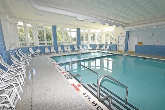 a living room with lots of furniture and a table
