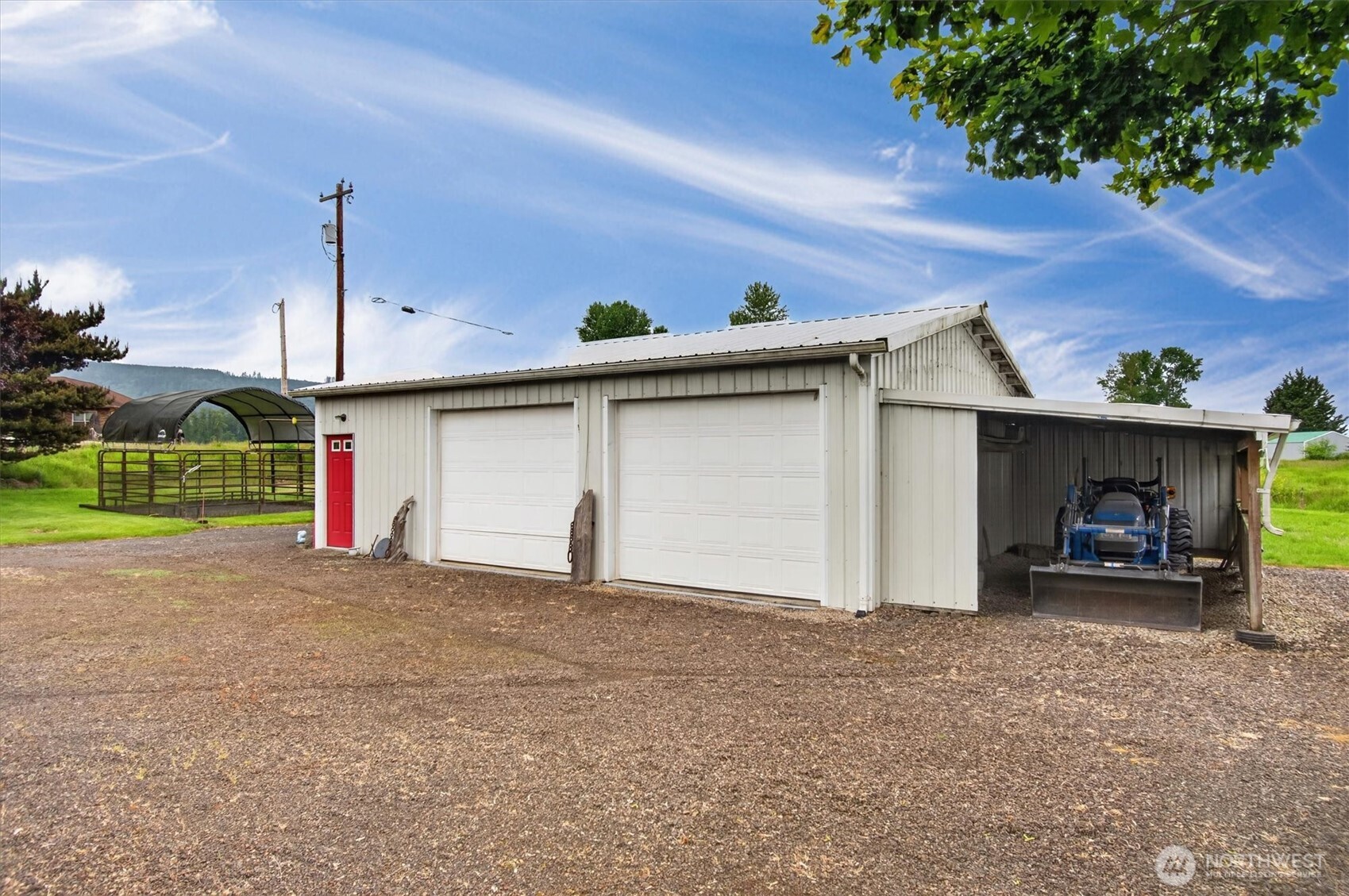 218 West Sunny Sands Road Cathlamet, WA 98612 - Photo 27 of 40 a view of a house with a yard and garage