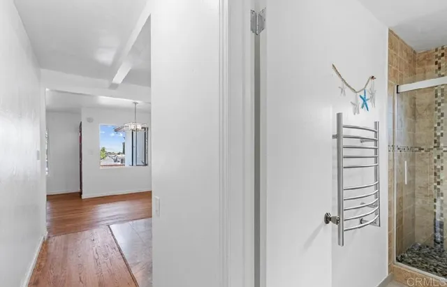 a view of a hallway view with wooden floor and staircase