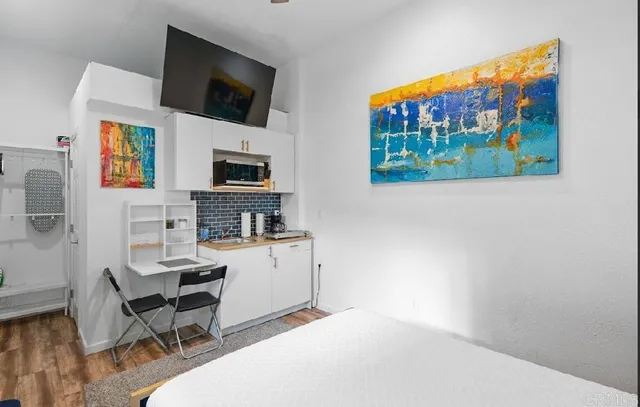 a room with furniture and a flat screen tv