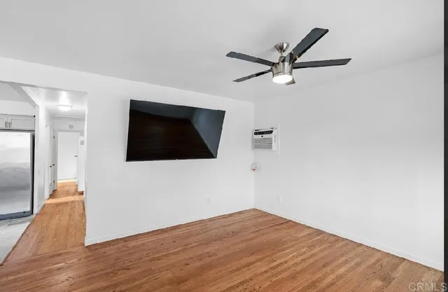 a view of a livingroom with wooden floor