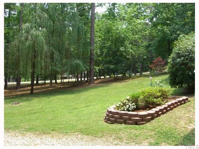 204 Irelan Drive Raleigh, NC 27606 - Photo 2 of 12 a view of a garden with large trees
