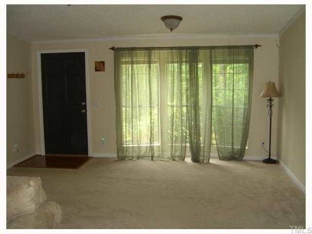 204 Irelan Drive Raleigh, NC 27606 - Photo 7 of 12 a view of an empty room with a window