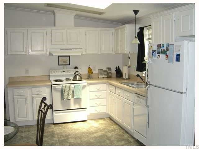 204 Irelan Drive Raleigh, NC 27606 - Photo 9 of 12 a kitchen with appliances a sink and cabinets