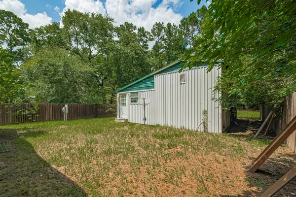 a backyard of a house with lots of green space