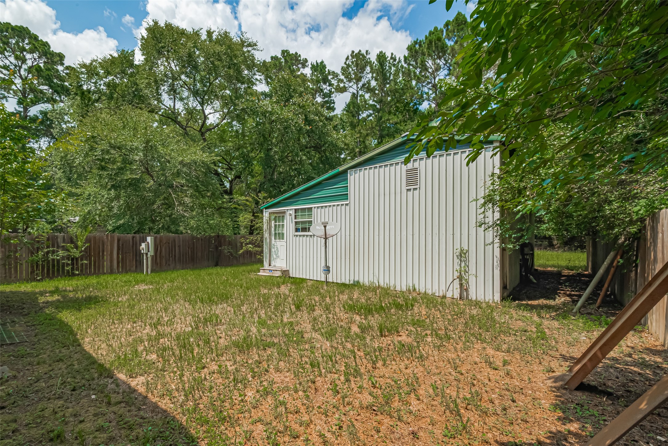 477 Canadian Drive Trinity, TX 75862 - Photo 5 of 11 a backyard of a house with lots of green space