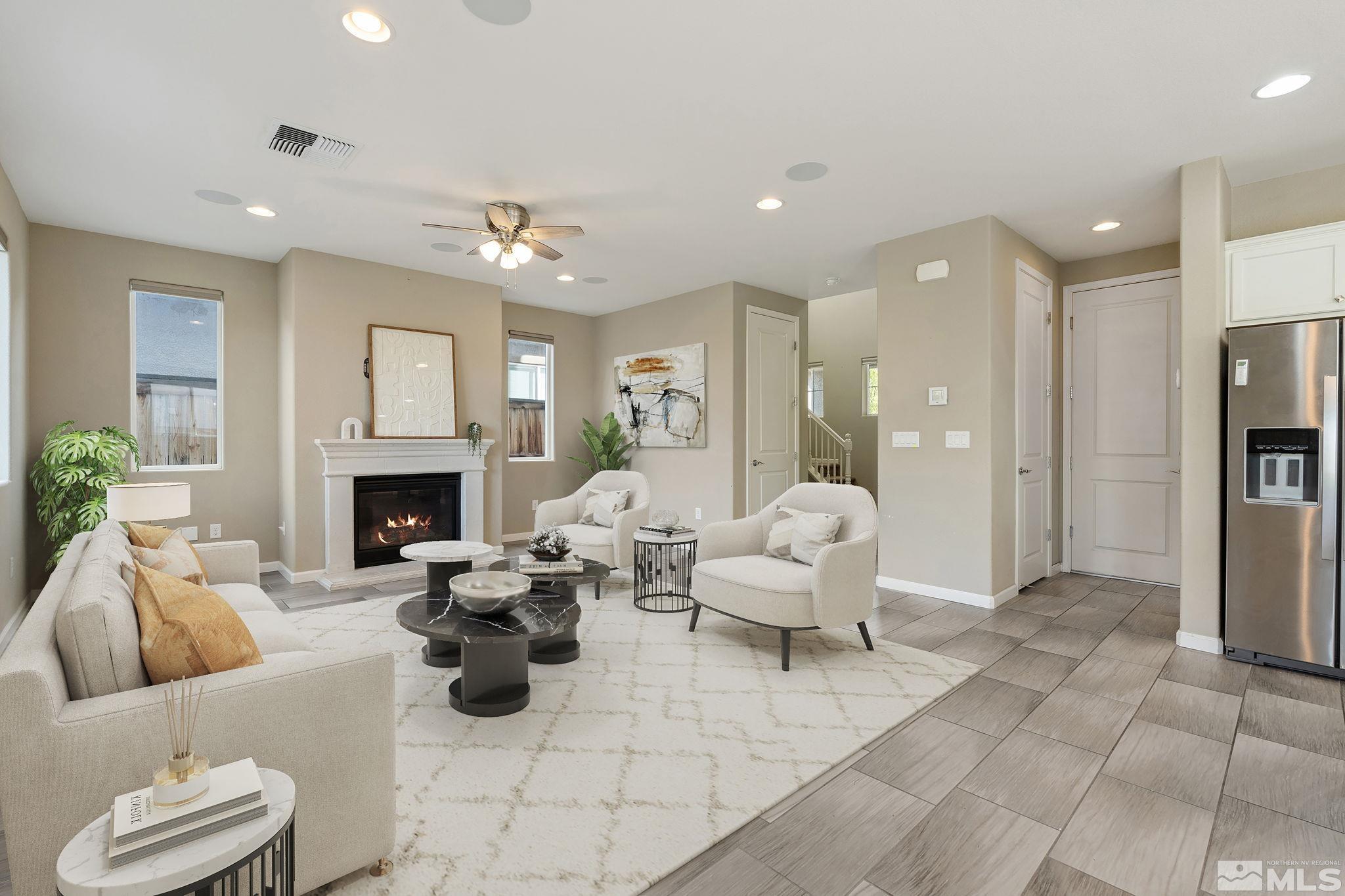 3025 Ethelinda Way Reno, NV 89521 - Photo 4 of 31 a living room with furniture and a fireplace
