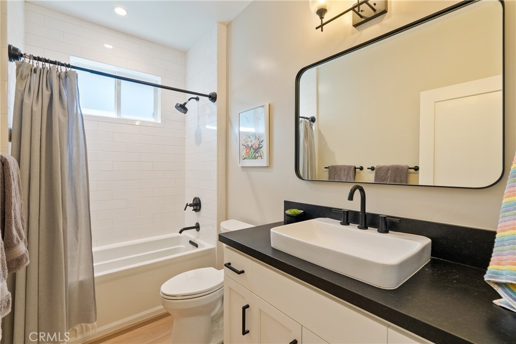 8550 El Corte Road Atascadero, CA 93422 - Photo 39 of 72 a bathroom with a sink a toilet and a mirror