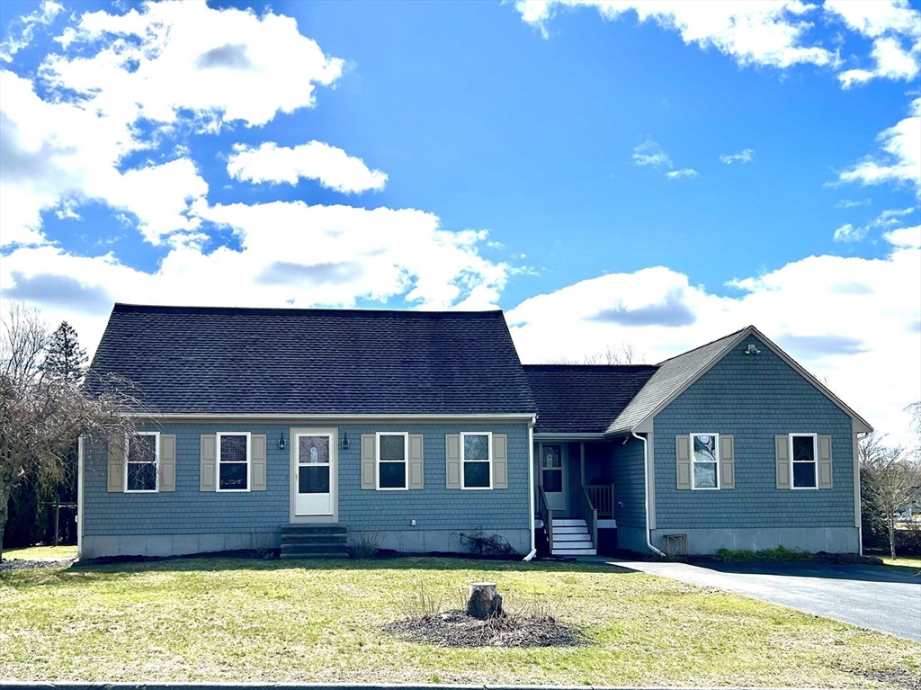 43 Boston Hill Road Fairhaven, MA 02719 - Photo 1 of 25 a front view of a house with a yard