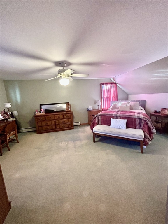 43 Boston Hill Road Fairhaven, MA 02719 - Photo 23 of 25 a bedroom with a bed and a chandelier