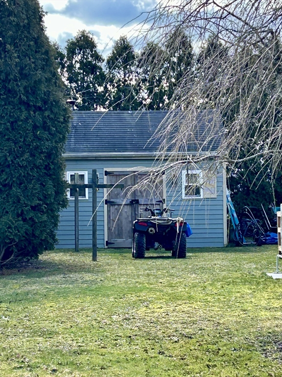 43 Boston Hill Road Fairhaven, MA 02719 - Photo 3 of 25 a view of a backyard with a barn