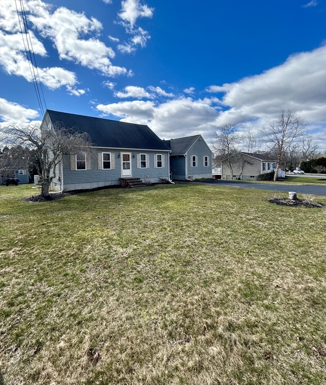 43 Boston Hill Road Fairhaven, MA 02719 - Photo 4 of 25 a view of a house with a big yard