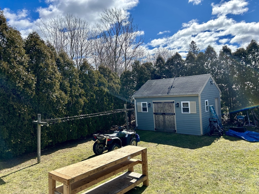 43 Boston Hill Road Fairhaven, MA 02719 - Photo 7 of 25 a view of a roof deck with couches and wooden fence