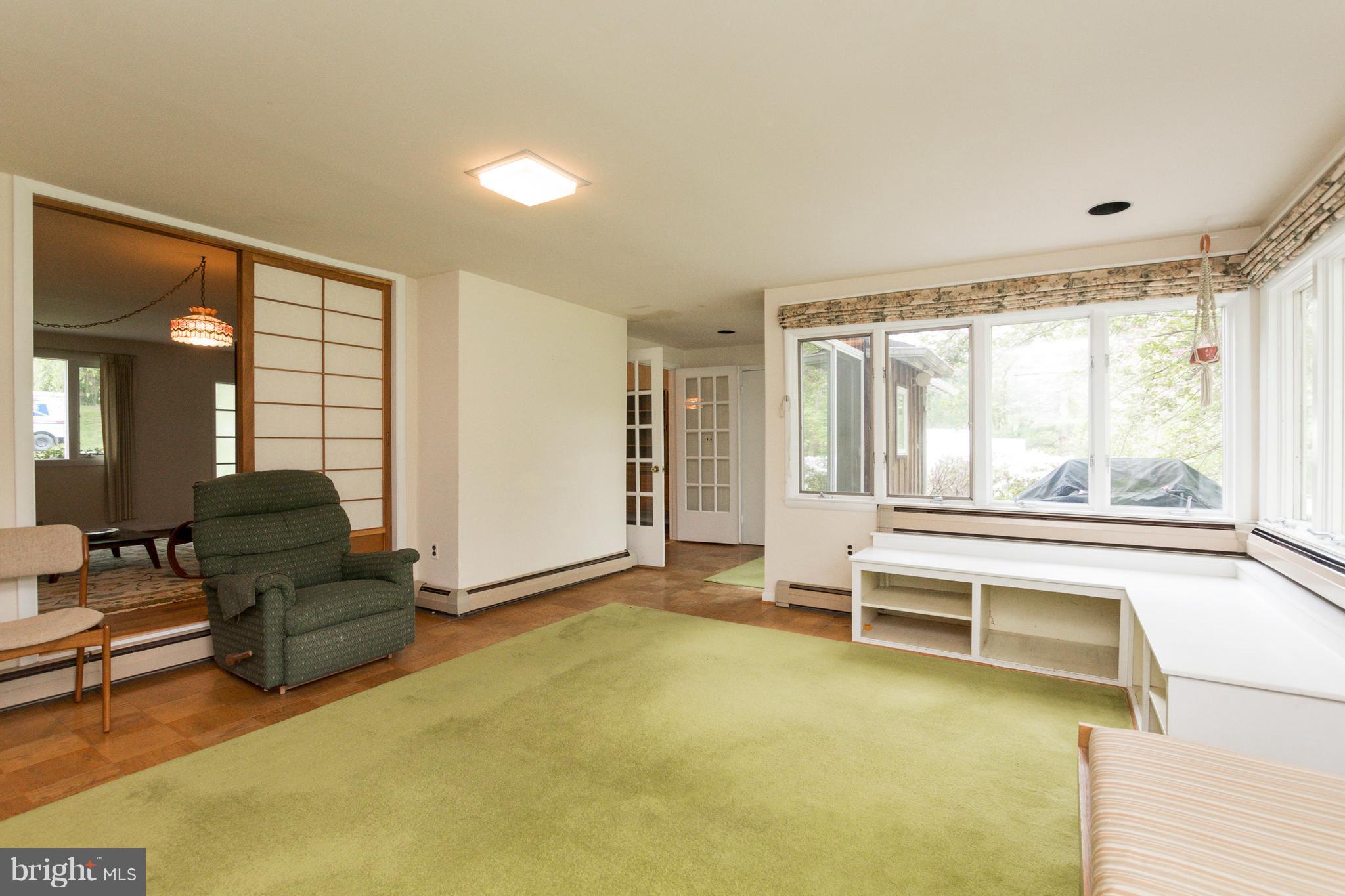 7916 Springway Road Baltimore, MD 21204 - Photo 14 of 23 Family room with view of backyard