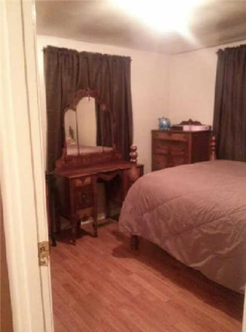 585 Ramsey Road Lebanon, TN 37087 - Photo 5 of 13 a bed sitting in a bedroom next to a window
