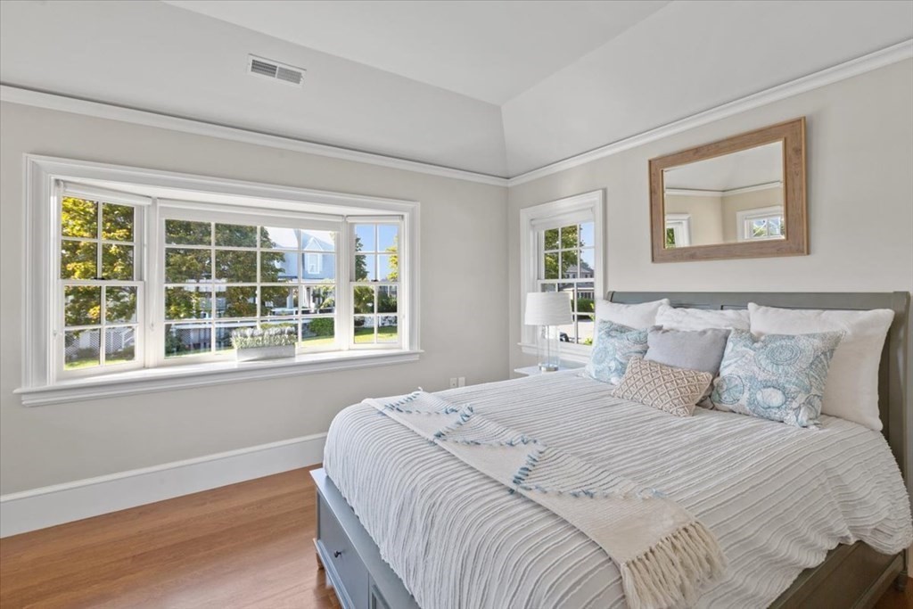 15 Spray Avenue Marblehead, MA 01945 - Photo 29 of 42 a bedroom with a bed and a large window