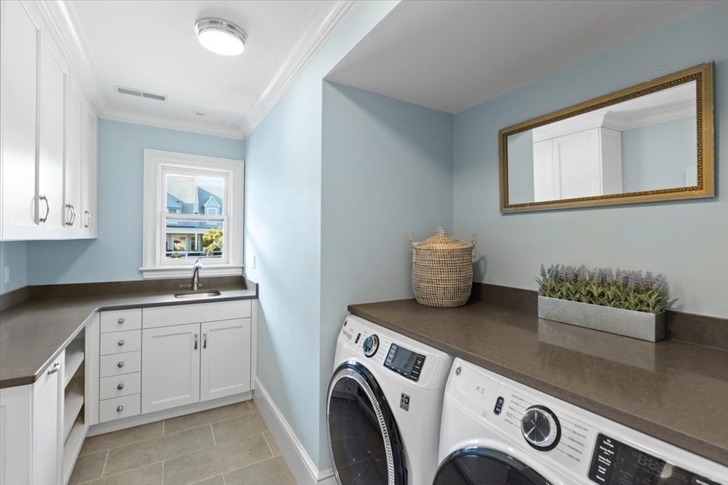 15 Spray Avenue Marblehead, MA 01945 - Photo 31 of 42 a utility room with sink dryer and washer