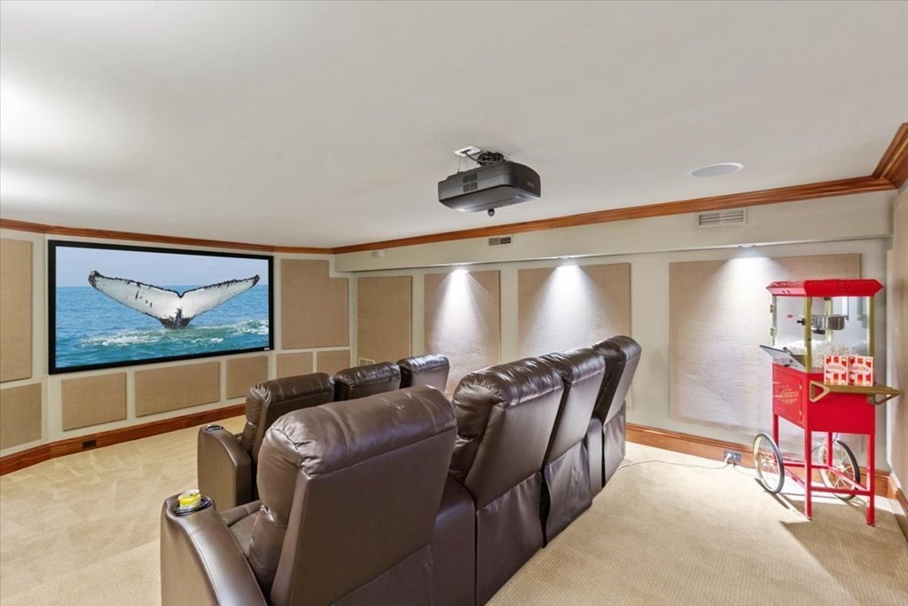 15 Spray Avenue Marblehead, MA 01945 - Photo 33 of 42 a media room with lots of chairs and a projector screen