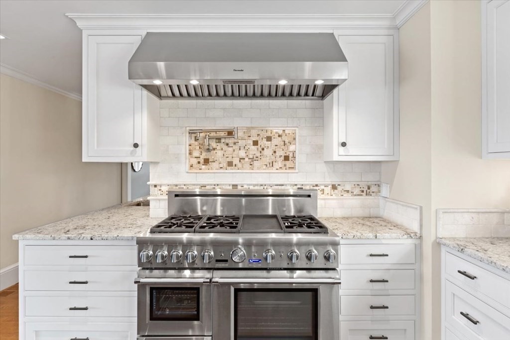 15 Spray Avenue Marblehead, MA 01945 - Photo 9 of 42 a stove top oven sitting inside of a kitchen