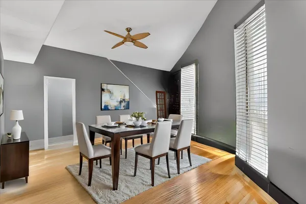 a view of a dining room with furniture and window