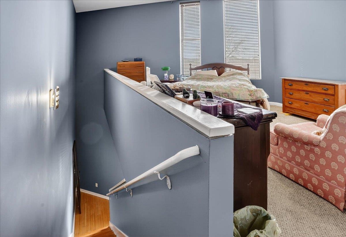 440 North Front Street, Unit 202 Memphis, TN 38105 - Photo 12 of 20 a bed sitting in a bedroom next to a window