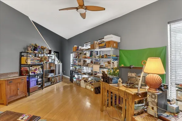 a living room with lots of furniture and a wooden floor