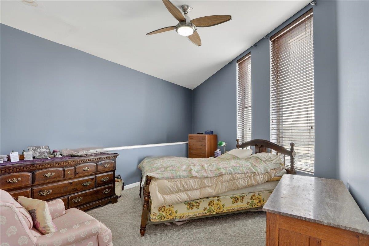 440 North Front Street, Unit 202 Memphis, TN 38105 - Photo 13 of 20 a bedroom with furniture and a window