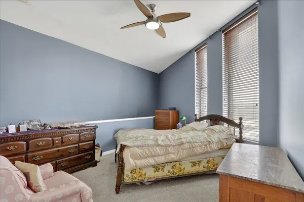a bedroom with furniture and a window