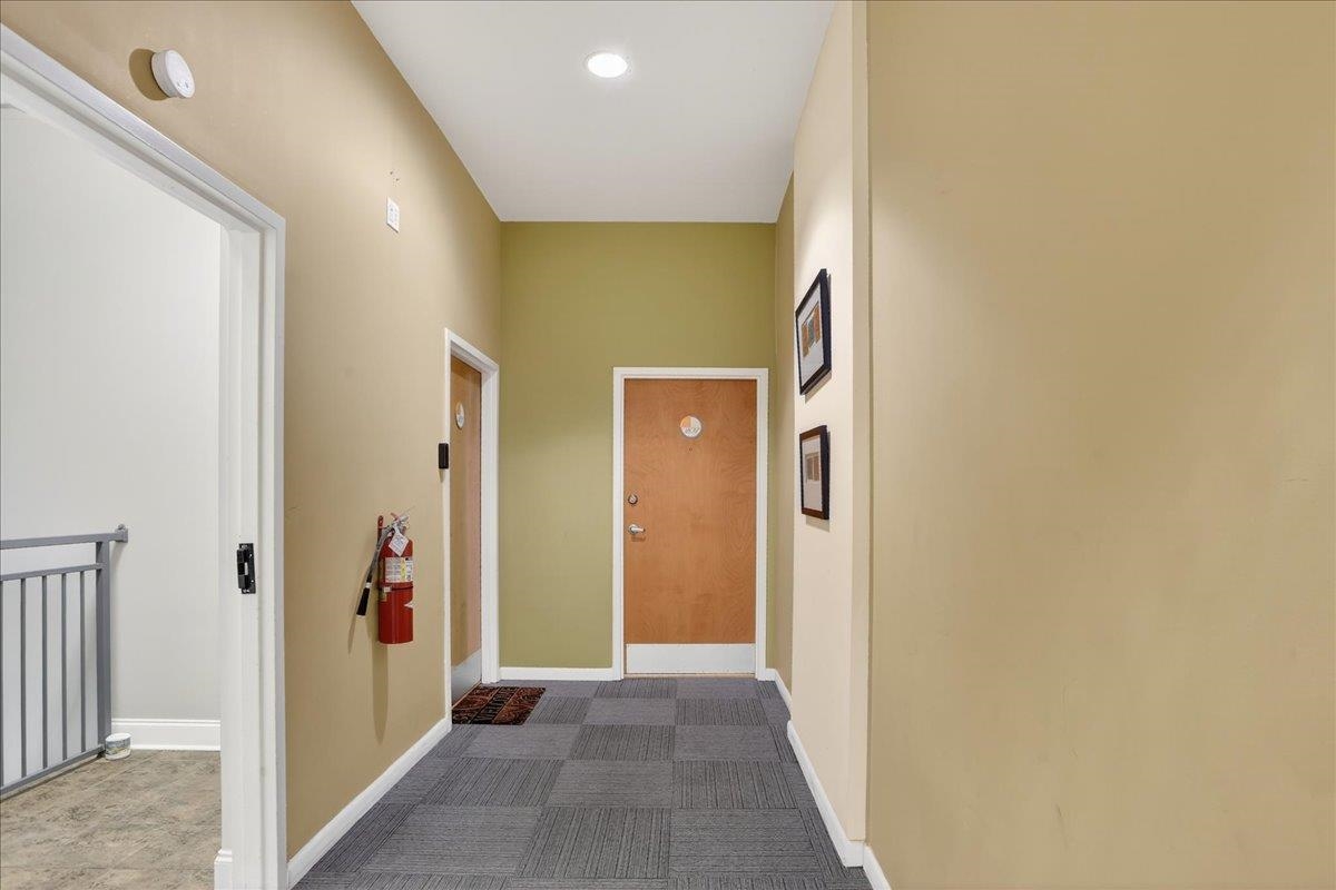 440 North Front Street, Unit 202 Memphis, TN 38105 - Photo 4 of 20 a view of a hallway with wooden shelves