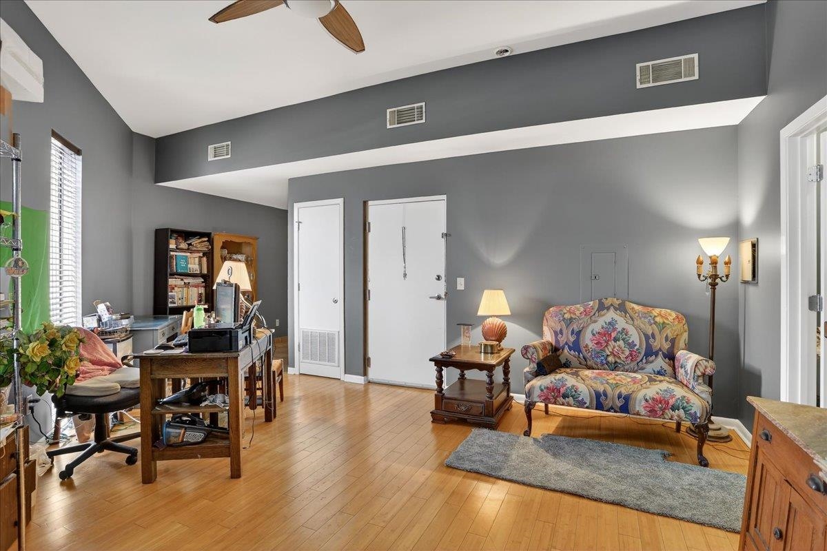 440 North Front Street, Unit 202 Memphis, TN 38105 - Photo 6 of 20 a living room with furniture and wooden floor