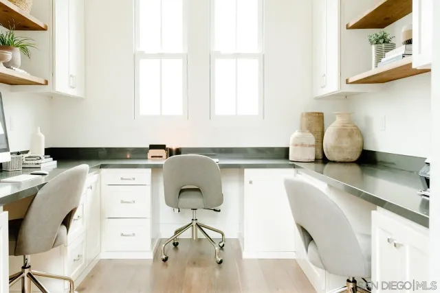 a kitchen with a sink cabinets and a window