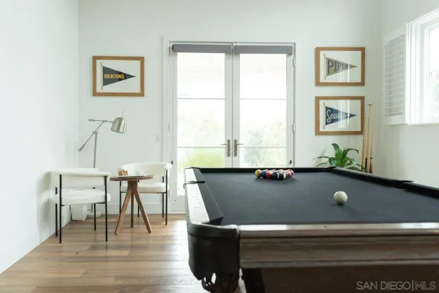 a view of a workspace with furniture and window